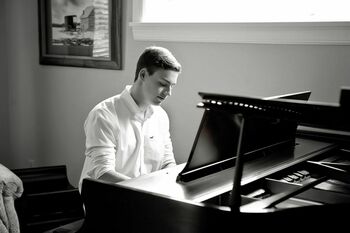 Glynn scholar Noah Bongiovanni playing the piano