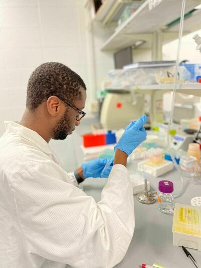 Armel conducting research in a lab